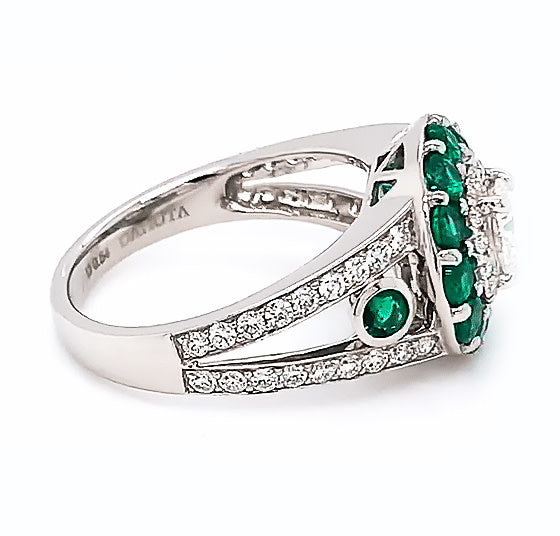 Platinum engagement ring with diamonds and emeralds