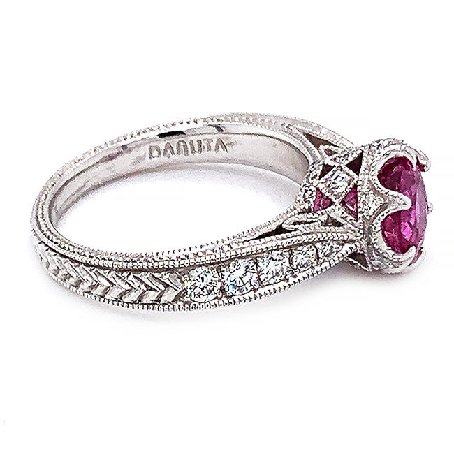 Platinum engagement ring with pink sapphire and diamonds